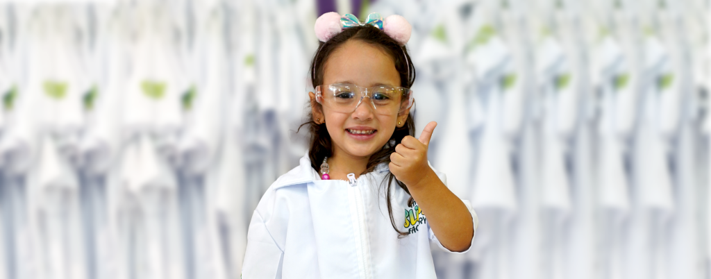 Child with labcoats and goggles